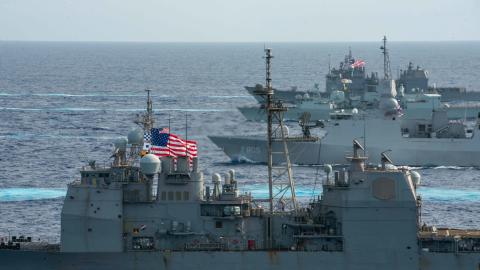 The United Kingdom’s carrier strike group led by HMS Queen Elizabeth and the Japan Maritime Self-Defense Force led by Hyuga-class helicopter destroyer JS Ise conduct multiple carrier strike group operations with US Navy carrier strike groups led by flagships USS Ronald Reagan and USS Carl Vinson in the Philippine Sea on October 3, 2021. (DVIDS)