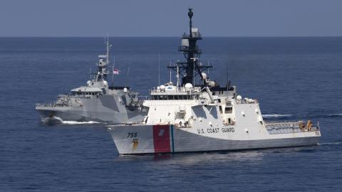 U.S. Coast Guard Cutter Munro (WMSL 755) (foreground) conducts coordinated ship maneuvers with Royal Navy vessel HMS Spey (P234) Sept. 17, 2023, in the South China Sea. Munro is deployed to the Indo-Pacific to advance relationships with ally and partner nations to build a more stable, free, open and resilient region with unrestricted, lawful access to the maritime commons. (U.S. Navy photo by Chief Petty Officer Brett Cote)