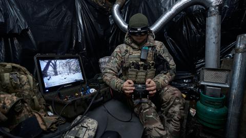 A soldier launches a kamikaze drone at Russian positions on January 26, 2024, in Kupiansk, Ukraine. (Photo by Kostiantyn Liberov/Libkos/Getty Images)