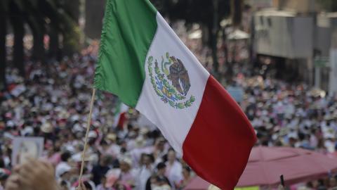 A Mexican flag waves on the esplanade of the Monument to the Revolution in Mexico City on November 13, 2022. (Photo by Gerardo Vieyra/NurPhoto via Getty Images)