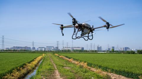 A drone sprays pesticides at Baiyutan Modern Agriculture Demonstration Park in Kunshan, China, on April 18, 2024. (Photo by Costfoto/NurPhoto via Getty Images)