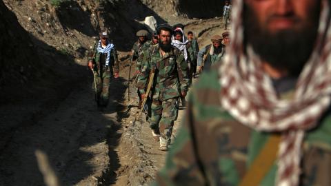 Taliban security personnel arrive to destroy a poppy field in Argo district on May 12, 2024. (Photo by Omer Abrar/AFP via Getty Images)