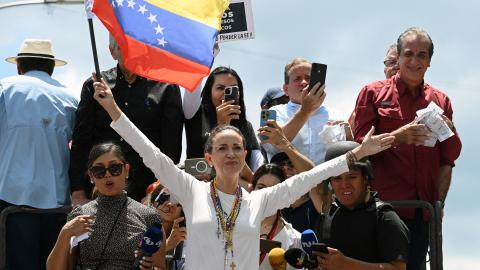 Venezuelan opposition leader María Corina Machado holds a national flag during a protest calling for the recognition of election "victory" in Caracas, Venezuela, on August 17, 2024. (Federico Parra/AFP via Getty Images)