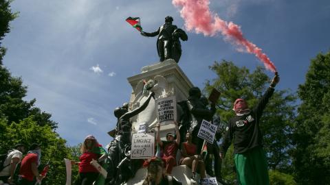 Pro-Palestinian demonstrators leave Palestinian flags and graffiti on the Rochambeau Statue in Lafayette Park next to the White House on June 8, 2024. (Probal Rashid/LightRocket via Getty Images)