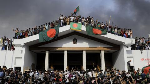 Anti-government protestors storm Prime Minister Sheikh Hasina's palace in Dhaka, Bangladesh, on August 5, 2024. (K M Asad/AFP via Getty Images)