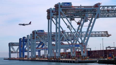 Work is done before a dockworkers strike was called at Conley Container Terminal on September 30, 2024, in Boston. (David L. Ryan via Getty Images)