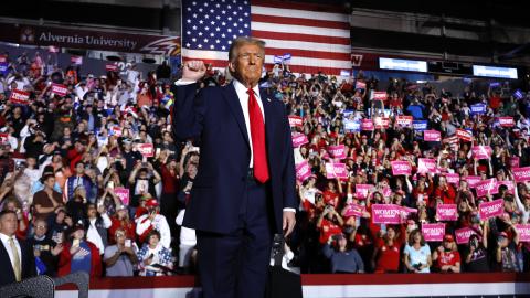 Donald Trump holds up a fist at a campaign rally on November 4, 2024, in Reading, Pennsylvania. (Chip Somodevilla via Getty Images)