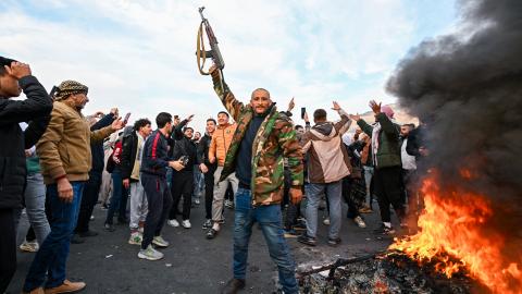 People celebrate at Umayyad Square in Damascus, Syria, on December 8, 2024. (Louai Beshara/AFP via Getty Images)