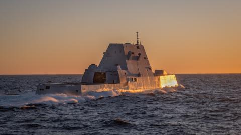  (February 10, 2024) — The Zumwalt Class Guided Missile Destroyer USS Michael Monsoor (DDG 1001) breaks away from the Henry J. Kaiser-class fleet replenishment oiler USNS Pecos (T-AO 197) shortly before sunset after taking on fuel. (U.S. Navy photo by Chief Mass Communication Specialist Mark D. Faram)