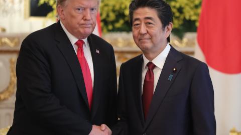 President Donald Trump and Shinzo Abe shake hands prior to their meeting on May 27, 2019, in Tokyo, Japan. (Eugene Hoshiko via Getty Images)