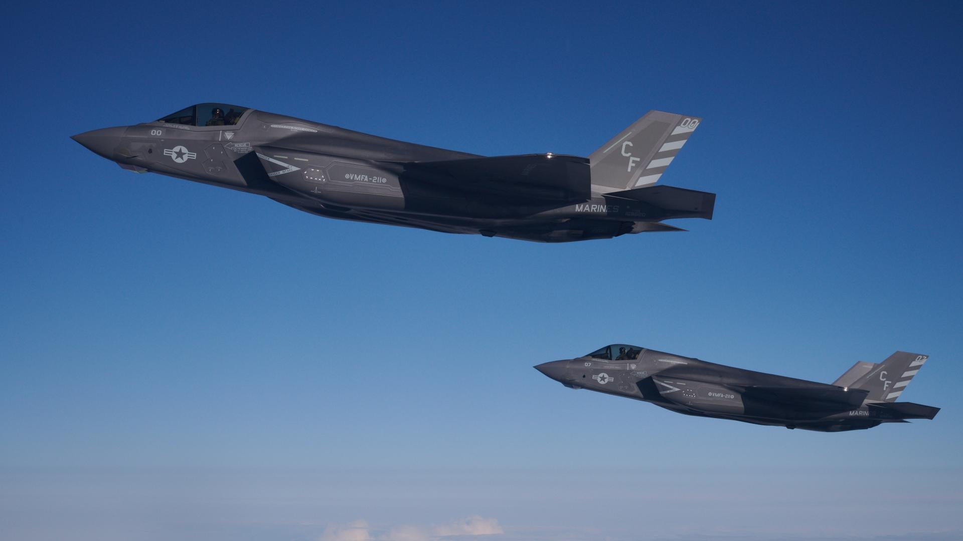 Two F-35B combat aircraft from the United States Marine Corp depart after re-fueling from an RAF Voyager aircraft over the North Sea on October 08, 2020 in flight, above Scotland. 