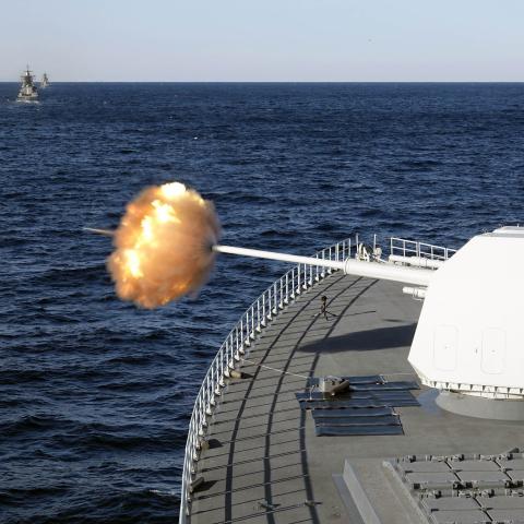 The main gun of Chinese guided-missile destroyer Nanchang attacks target during a China-Russia military drill on October 15, 2021, in Russia. (Sun Zifa/China News Service via Getty Images)